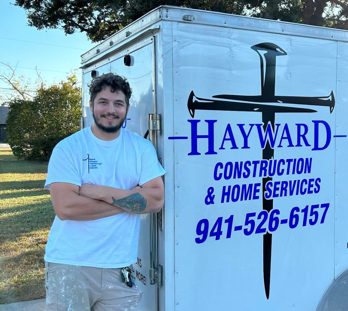 Hayward Construction owner in front of branded work truck