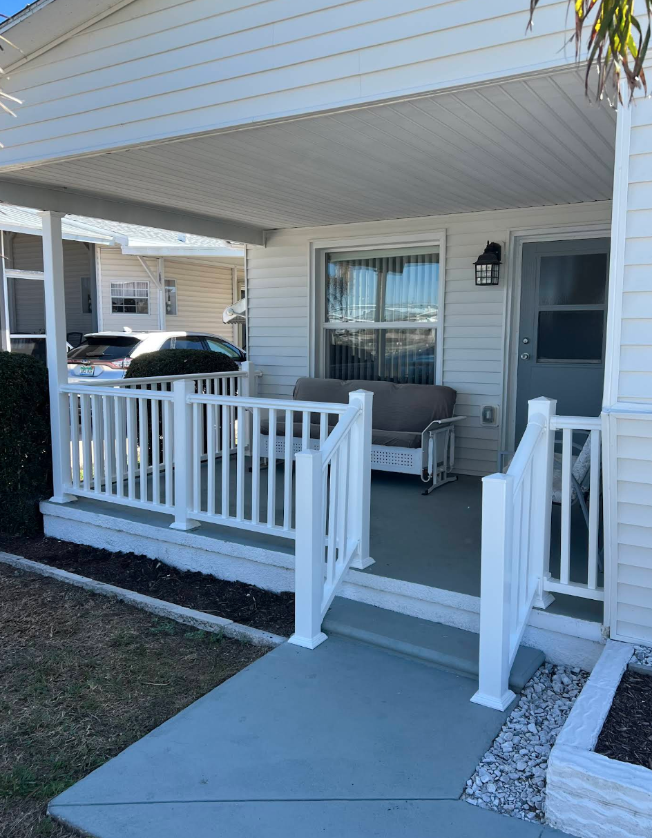 Finished white porch with railing